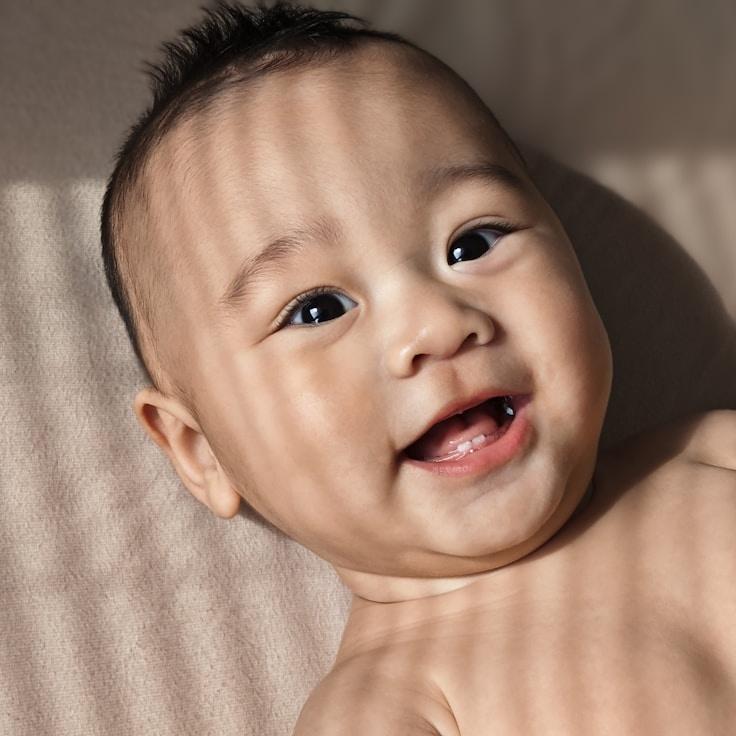 Alicia Turner, Lead Design Curator at MeadowlarkShop, reviewing corporate floral arrangements